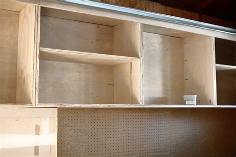 Most garage cabinets come disassembled metal frame cabinets are made from an assortment of angle bars that are cut to size, provided with drilled holes as well as being welded for structural integrity. Wall Hanging Cabinets Garage | Homeminimalisite.com