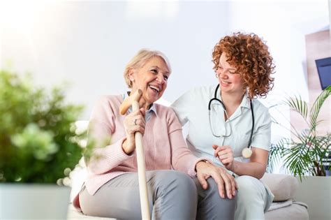 Premium Photo Friendly Relationship Between Smiling Caregiver In