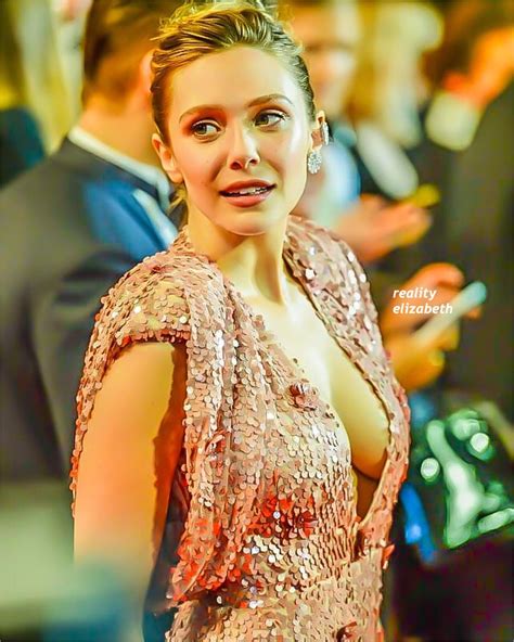 The sheer dress showed off her unmentionables underneath and wore her brown locks parted on side. Elizabeth Olsen!...#elizabetholsen #lizzie #princesslizzie ...