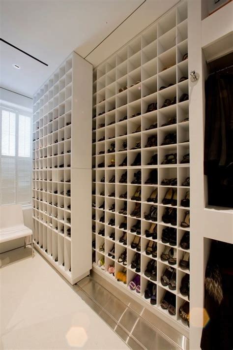 Along the back wall, smart open storage solutions involving shelves and hanging racks set the stage for a curated collection of shoes, clothing, and accessories. 27 Space-Saving Closet Wall Storage Ideas To Try - Shelterness