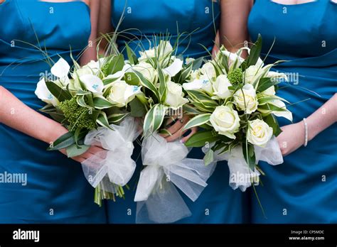 Bridesmaids Holding Bouquet Of Flowers At A Wedding Stock Photo Alamy