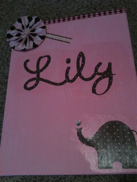 A Pink Canvas With An Elephant And The Word Lilly Painted On It