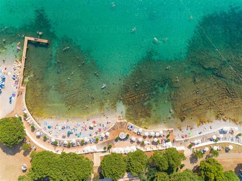 Aerial View Of People Enjoying The Beach At Alba Chiara Medulin