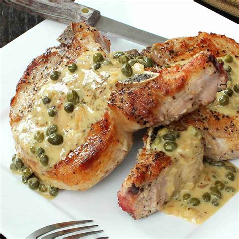 Dredge each side of the pork chops in the flour mixture, and then set aside on a plate. Seared Pork Chops in Caper Sauce Recipe | How To Feed a Loon