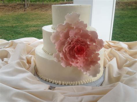 Book your wedding cake early. 3-tiered wedding cake with cascading gum paste flower that ...