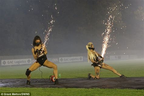 Bonfire Night Firework Display Includes Women Shooting Sparks From