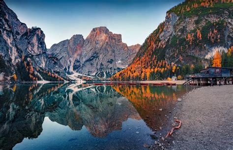 Superb Autumn View Of Braies Pragser Wildsee Lake With Boats And