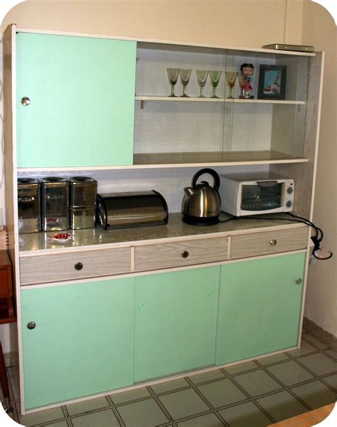Functional and simple furnishing and equipment characterizes this time. 1950s kitchen cabinet - redone... looks like what we had ...
