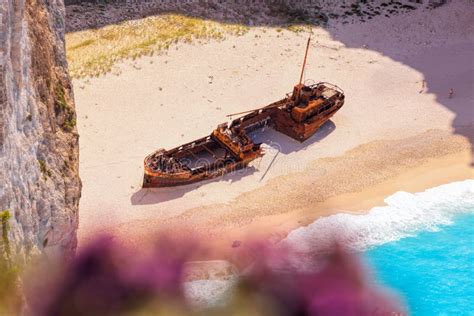 Navagio Beach With Shipwreck And Flowers On Zakynthos Island In Greece