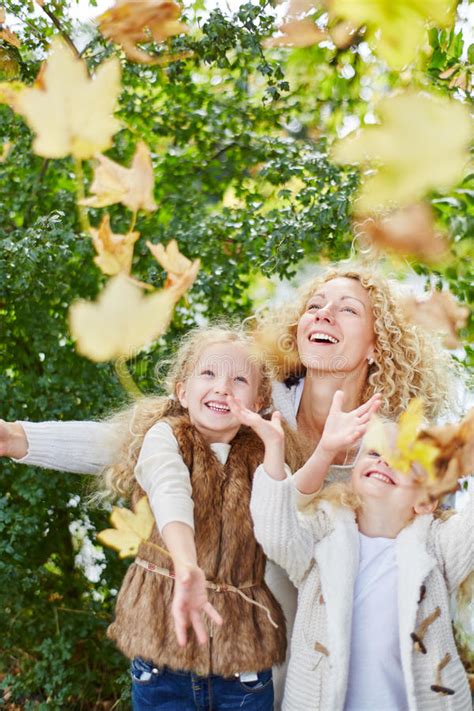 Kids Playing With Leaves In The Park Stock Photo - Image of outdoors ...