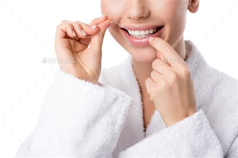 Cropped View Of Woman In White Bathrobe Flossing Teeth Isolated On