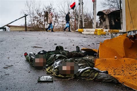 Ukrainian Officials Post Grim Photos Of Dead Russian Soldiers Online
