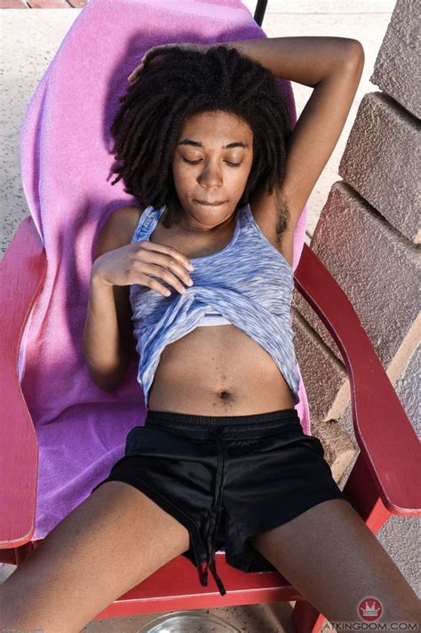 Black Girl With Dreadlocks And Small Tits Sits On A Red Chair To Piss Outdoors