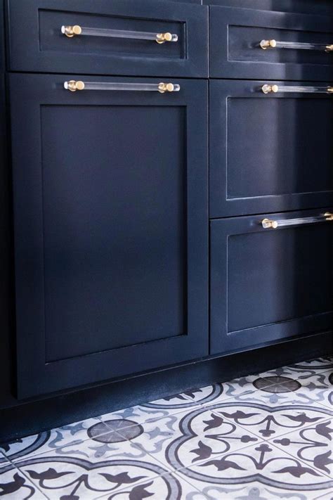 Here are our 20 simple and modern bathroom cabinet designs with images. Deep Navy Blue Cabinets and Pattern Tile Modern Laundry ...
