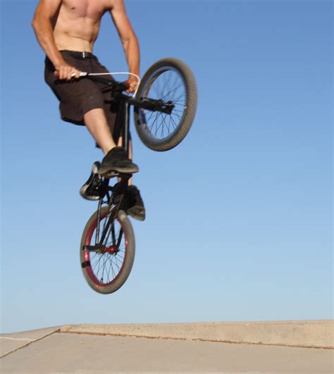 I think you have to hold until the trick completes, then let go with enough time to make the landing properly. BMX Bicycle freestyle: Easy to Learn BMX Bike Tricks