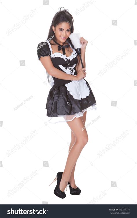 Beautiful Sensual Woman Posing In A Skimpy Maids Uniform With Miniskirt