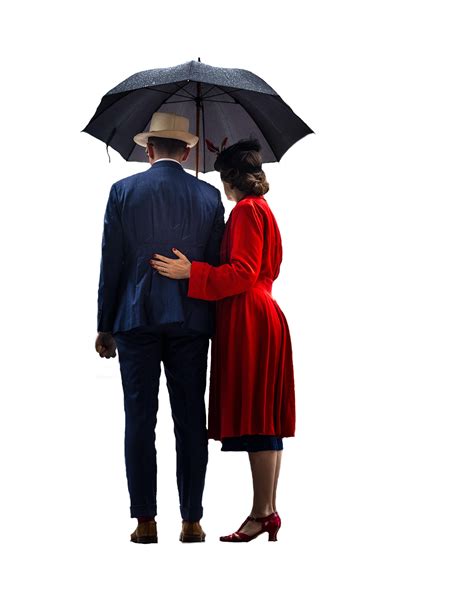 A Man And Woman Are Standing Under An Umbrella Facing Each Other With