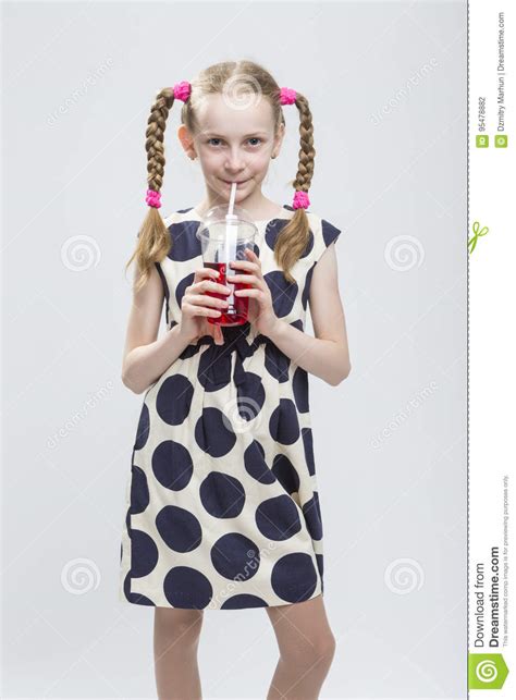 Portrait Of Smiling Caucasian Little Girl With Pigtails Stock Photo