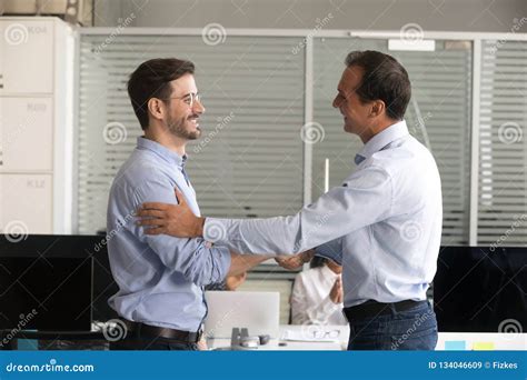 Friendly Middle Aged Boss Handshaking Male Employee Stock Image Image
