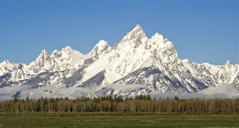 Dramatic sunrise photograph of the teton range from signal mountain in grand teton national park near jackson, wyoming. Teton Range | mountains, Wyoming, United States | Britannica