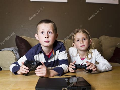 Siblings Playing Video Games — Stock Photo © Gemenacom 4272008