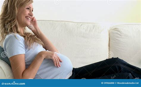 Laughing Pregnant Woman Talking On Phone Lying On The Sofa Stock Footage Video Of Cell