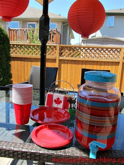 Canada day party decorations and ideas blend red and white decorating colors into outdoor home decor, brightening. Canada Day Party Ideas - Moms & Munchkins