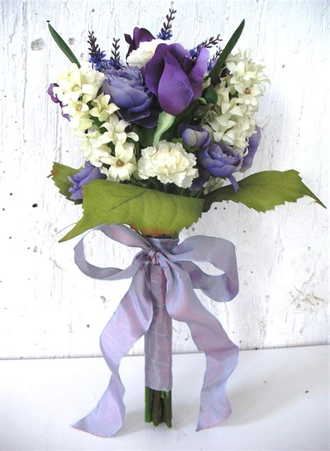 You can use shades of purple roses that cascade gracefully down. Purple roses and ranunculus with white hyacinths and ...