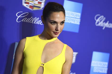 Gal Gadot Glows In A Yellow Dress With A Thigh High Slit And Strappy
