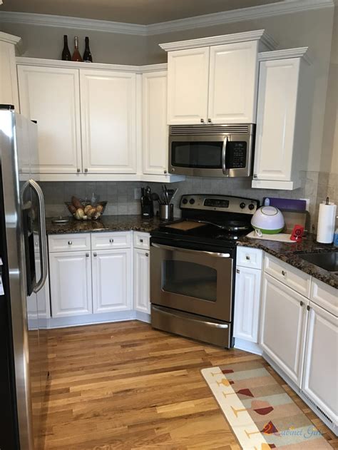 We already had solid oak cabinets that i didn't want to rip out because they were old but still good. SW Origami White - 2 Cabinet Girls