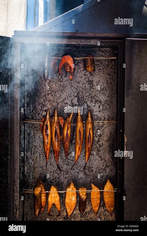 Fresh Smoked Fish In Steel Smokehouse With Opened Door Stock Photo Alamy