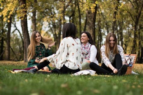 Group Of Young Women Out On A Fun Picnic In The Park Stock Image