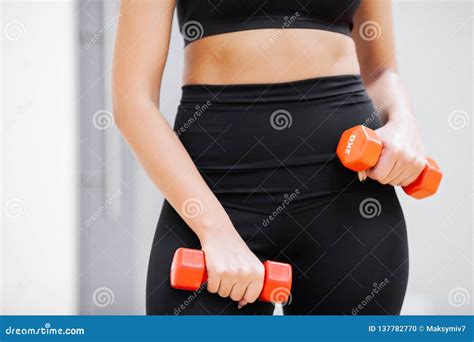 Young Athletic Girl With Dumbbells Indoors Fitness Girl Workout In The