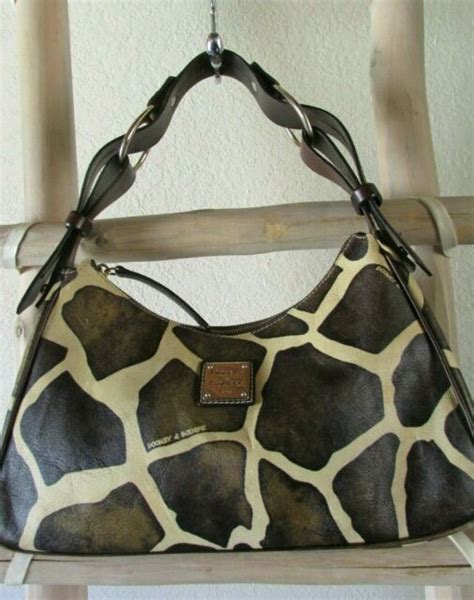 Vintage Dooney And Bourke M Cow Print Coated Canvas Brown Leather Trim