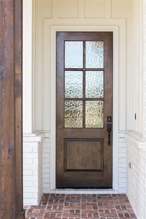 Wood Door With Glass Entryway Against White Exterior Walls Modern