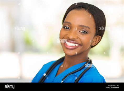 Portrait Of Happy Young African Female Nurse In Office Stock Photo Alamy