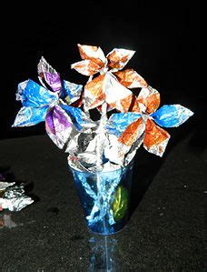 One 12 ounce bag makes about 14 to 16 wrappers. Bouquets of flowers made out of Dove Chocolate wrappers and tin foil. Check out how and why they ...