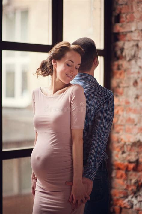 Cropped Image Of Beautiful Pregnant Woman And Her Handsome Husband
