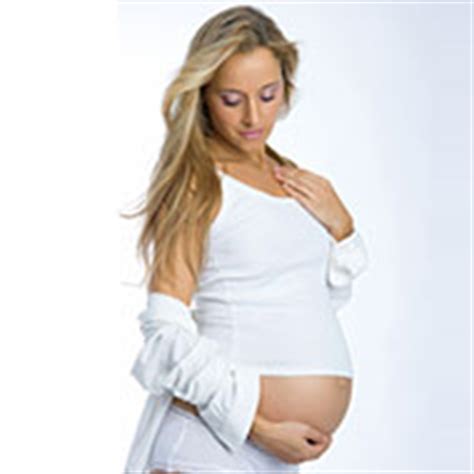 Pregnant woman in red bikini. Hair & Foot Spa During Pregnancy