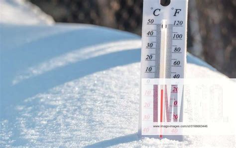 The Thermometer Lies On The Snow And Shows A Negative Temperature In