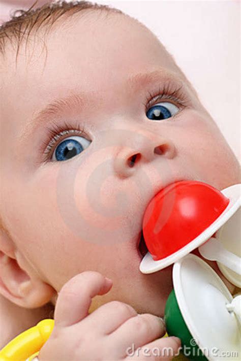 Baby Girl Biting Rattle Stock Photo Image Of Babies Head 9432592