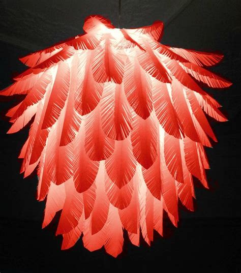 We recommend blowing the feathers with a hairdryer on a cold setting. Red Feather Paper feather hanging light by ...