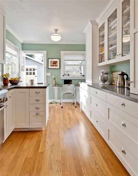 Though this kitchen's range and cabinets are both white, one has brass hardware, while the other has silver. Magnificent Sherwin Williams Sea Salt trend San Francisco ...