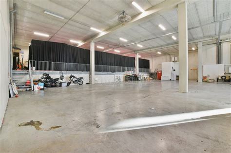The Inside Of A Building With Motorcycles Parked In It Stock Image