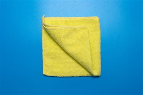 Premium Photo Yellow Microfiber Cloth For Different Surfaces Cleaning