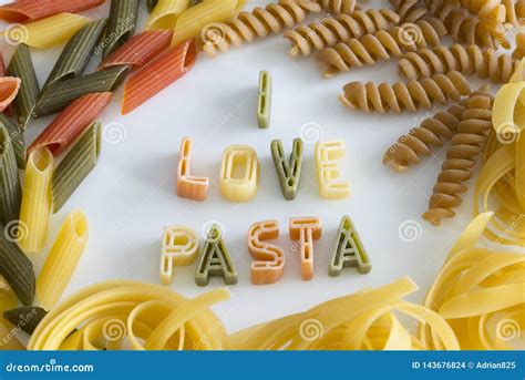 Pasta Text Of Macaroni Letters In A Round Macaroni Frame On A Yellow