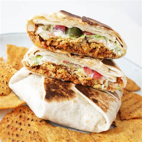 Made with vegan ground beef, homemade vegan cheese sauce, vegan sour cream, tomatoes. Vegan Crunchwrap Supreme | Cheap And Cheerful Cooking