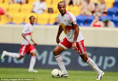 A hot lower back flourish tattoo. Thierry Henry shows off new tattoo on right arm | Daily ...
