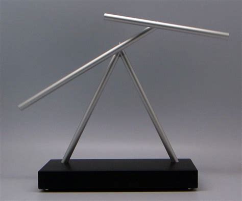 The swinging sticks desktop toy. Iron Man 2 Swinging Sticks Kinetic Energy Sculpture ...