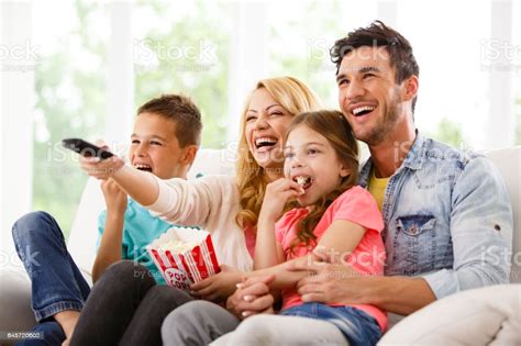 Bean then, if you have netflix, watch the tv shows and tell me which one is funnier. Family Watching Funny Movie Together Stock Photo ...